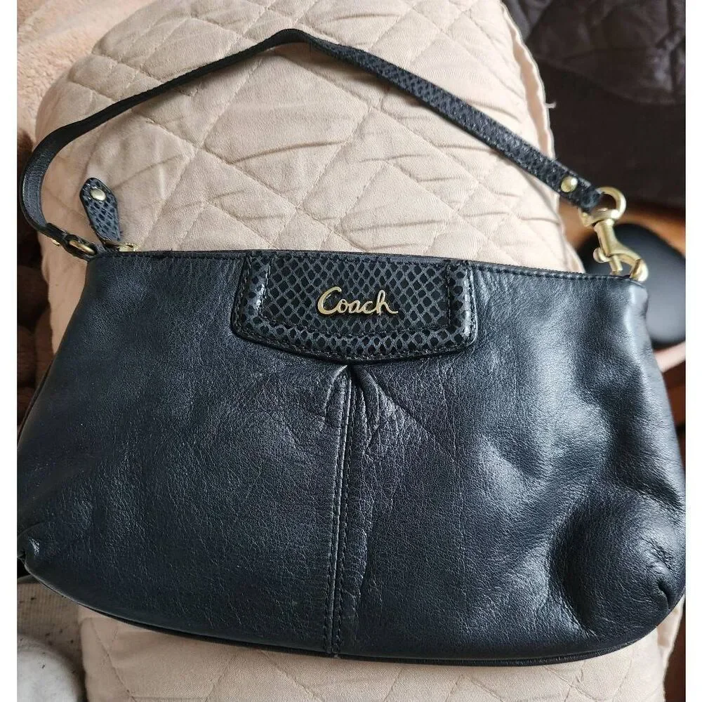 Coach Ashley large black leather wristlet. Approx 9.5 wide, 5.5 high